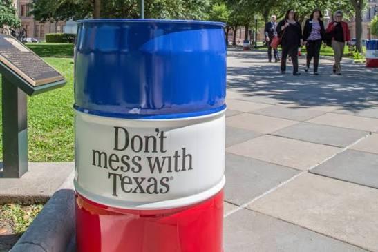 Texas Works Services barrel in a downtown city park